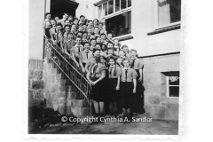 Girls_standing_on_stairs